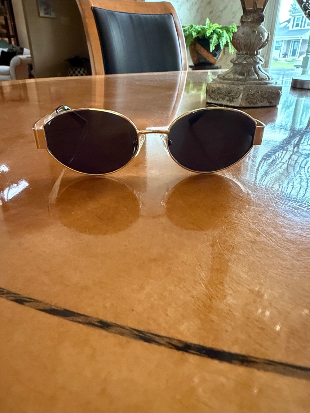 Gold Frame Oval Sunglasses with Dark Lenses